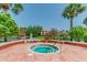 Relaxing hot tub surrounded by lush landscaping and tranquil waterfront views, ideal for unwinding after a long day at 10263 Gandy N Blvd # 2014, St Petersburg, FL 33702