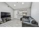 Bright living room with modern flooring, a TV, and comfortable seating at 10263 Gandy N Blvd # 2014, St Petersburg, FL 33702