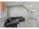 Comfortable living room with gray vinyl flooring and vaulted ceilings at 10263 Gandy N Blvd # 2014, St Petersburg, FL 33702