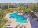 Large community pool area with lounge chairs and tropical landscaping from an elevated perspective at 10263 Gandy N Blvd # 2014, St Petersburg, FL 33702