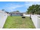 Expansive backyard with new fence, a well-kept lawn, and ample space for recreation and relaxation at 11414 Coconut Island Dr, Riverview, FL 33569