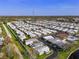 Overhead view of a mobile home community featuring lush landscapes, a pond, and access roads at 12501 Ulmerton Rd # 34, Largo, FL 33774