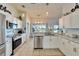 Bright, open kitchen with stainless steel appliances and granite countertops at 12804 Raysbrook Dr, Riverview, FL 33569