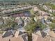 An aerial view of an attractive residential area with lush landscaping surrounding a tranquil lake at 14532 Mirabelle Vista Cir, Tampa, FL 33626