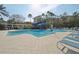 Community pool with a waterslide and plenty of lounge seating at 14532 Mirabelle Vista Cir, Tampa, FL 33626