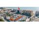This aerial shot shows a condo near the beach, a parking lot, and surrounding businesses at 14700 Gulf Blvd # 405, Madeira Beach, FL 33708