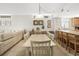 Dining room with seating for six and a view into the living area, ideal for gatherings at 14700 Gulf Blvd # 405, Madeira Beach, FL 33708