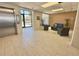 Well-lit lobby featuring tiled floors, comfortable blue sofa, and welcoming lounge area at 14700 Gulf Blvd # 405, Madeira Beach, FL 33708