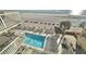 Aerial view of condo pool and beach access, perfect for vacation rentals and relaxation at 14700 Gulf Blvd # 405, Madeira Beach, FL 33708
