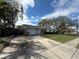 Charming single Gathering home with a spacious driveway and well-kept landscape at 14998 Mockingbird Ln, Clearwater, FL 33760