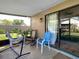 Relaxing covered porch with a hammock and rocking chairs, offering a peaceful outdoor space at 1513 Woonsocket Ln, Brandon, FL 33511