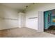 Bedroom view featuring white walls, shelving and neutral carpeting at 1547 Daylily Dr, Trinity, FL 34655