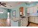 Kitchen featuring marble countertops, stainless steel appliances, and white cabinets at 1547 Daylily Dr, Trinity, FL 34655