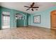 Spacious living room featuring light blue walls, wood-look tile floors and an archway at 1547 Daylily Dr, Trinity, FL 34655