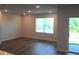 Living room featuring a large window and sliding glass doors leading to the backyard at 17036 James Trl, Parrish, FL 34219