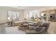 Bright living room featuring contemporary decor, open floor plan, and a large sectional at 17118 James Trl, Parrish, FL 34219