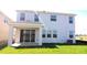 Backyard featuring a covered patio and a large sliding glass door at 1741 Cobb Trl, Parrish, FL 34219