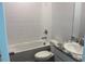 Bright bathroom featuring white subway tile surround, tub, and single vanity at 1741 Cobb Trl, Parrish, FL 34219