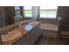 Elegant bathroom featuring a double vanity, soaking tub, and natural light from two windows at 1741 Cobb Trl, Parrish, FL 34219