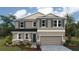 Charming two-story home with stone accents, a two-car garage, and well-manicured landscaping at 1741 Cobb Trl, Parrish, FL 34219