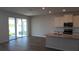 Spacious kitchen with stainless appliances, granite counters, and sliding door access to the patio at 1741 Cobb Trl, Parrish, FL 34219