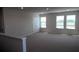 Open loft area with soft carpet, three windows and plenty of natural light at 1741 Cobb Trl, Parrish, FL 34219