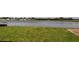 Lush green backyard featuring a large serene pond at 1741 Cobb Trl, Parrish, FL 34219