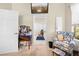 Bright room featuring a vanity table and chair, with blue patterned chair providing a charming sitting area at 182 Dahoon Ct, Spring Hill, FL 34609