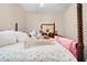 Bedroom detail showcasing a decorative tea set on a bed with floral quilt at 182 Dahoon Ct, Spring Hill, FL 34609