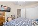 Neutral bedroom with a bed and a TV at 182 Dahoon Ct, Spring Hill, FL 34609
