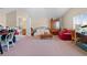 Open bonus room with flexible space, a desk area, seating, and an en-suite bathroom at 182 Dahoon Ct, Spring Hill, FL 34609