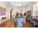 Elegant dining room with tray ceiling, hardwood flooring, and exquisite decorative details at 182 Dahoon Ct, Spring Hill, FL 34609