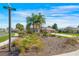 Charming single-story home featuring mature landscaping and a well-manicured front yard with a beautiful garden at 182 Dahoon Ct, Spring Hill, FL 34609