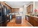 Open kitchen featuring stainless steel appliances, granite countertops, and a central island at 182 Dahoon Ct, Spring Hill, FL 34609