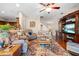 Open living room featuring a large entertainment center and comfortable seating at 182 Dahoon Ct, Spring Hill, FL 34609