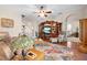 Inviting living room area with decorative lamp, entertainment center, and cozy furniture at 182 Dahoon Ct, Spring Hill, FL 34609