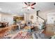Comfortable living room with ceiling fan, recliner chairs, area rug, and wood-look flooring at 182 Dahoon Ct, Spring Hill, FL 34609