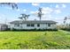 Large backyard featuring a well-maintained lawn at 19230 Lake Allen Rd, Lutz, FL 33558