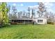 Green backyard featuring a screened-in porch at 19230 Lake Allen Rd, Lutz, FL 33558