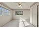 Comfortable bedroom with a ceiling fan and natural light at 19230 Lake Allen Rd, Lutz, FL 33558