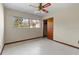 Bright bedroom featuring closet space and exterior views at 19230 Lake Allen Rd, Lutz, FL 33558