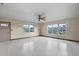 Open living room featuring large windows and lots of natural light at 19230 Lake Allen Rd, Lutz, FL 33558