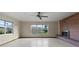 Spacious living room with brick fireplace and multiple windows at 19230 Lake Allen Rd, Lutz, FL 33558
