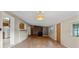 Spacious living room featuring tile flooring and a charming light fixture at 19230 Lake Allen Rd, Lutz, FL 33558
