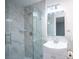 This is a stylish bathroom with a glass shower door and modern fixtures at 20004 Harvie Ln, Lutz, FL 33558