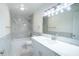 This stylish bathroom features a vanity with white cabinets and modern fixtures at 20004 Harvie Ln, Lutz, FL 33558