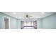 Spacious living room leads to enclosed lanai with backyard view at 20004 Harvie Ln, Lutz, FL 33558