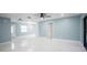 Open-concept living room boasts updated floors, fresh paint, and ample natural light at 20004 Harvie Ln, Lutz, FL 33558