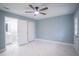 Light-filled main bedroom features ensuite bathroom and closet at 20004 Harvie Ln, Lutz, FL 33558