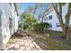Backyard featuring mature trees and lush green lawn at 211 Brandy Wine Dr # 211, Largo, FL 33771